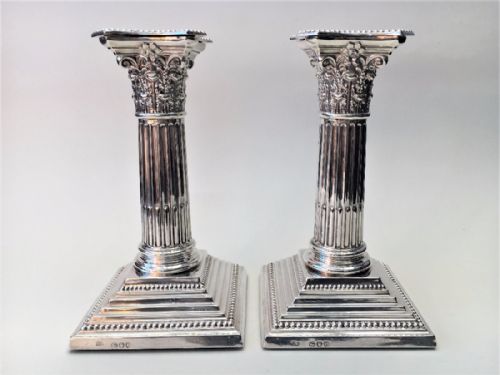 A Fabulous Pair of Victorian Silver Corinthian Column Candlesticks.