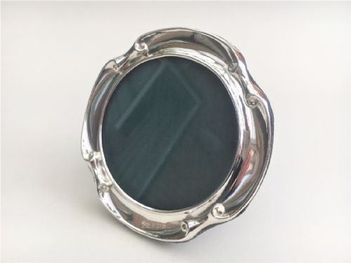 A Circular Victorian Silver Photo Frame.