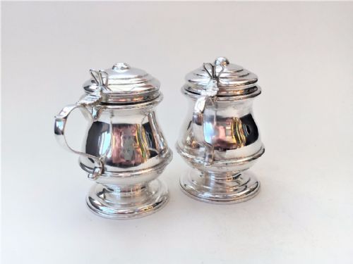 fig 1. A handsome pair of baluster shaped silver mustard pots.