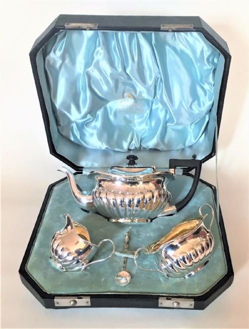 A Boxed Three Piece Late Victorian Silver Tea Set.