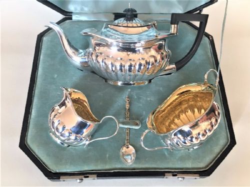 fig 1. A boxed three piece late Victorian silver tea set.
