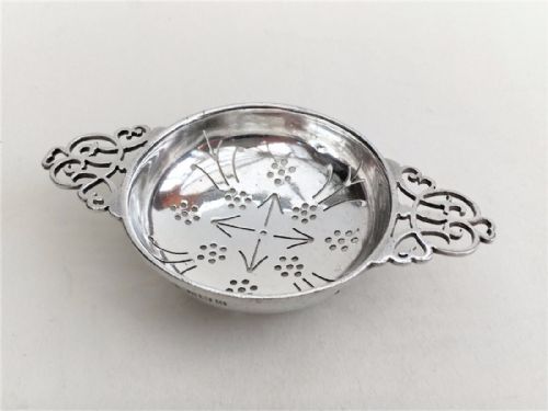 A Gorgeous Art Deco Period Silver Tea Strainer.