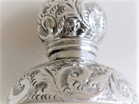 fig 1. A splendid silver mounted cologne bottle.
