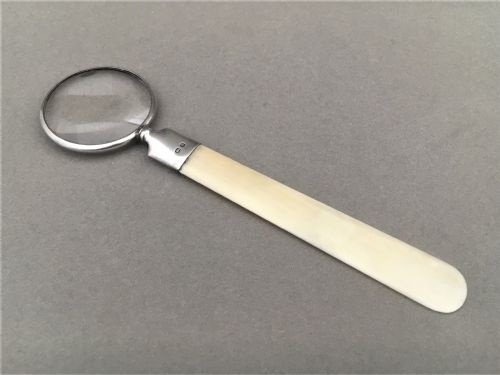 A Silver and Ivory Magnifying Letter Opener or Bookmark.