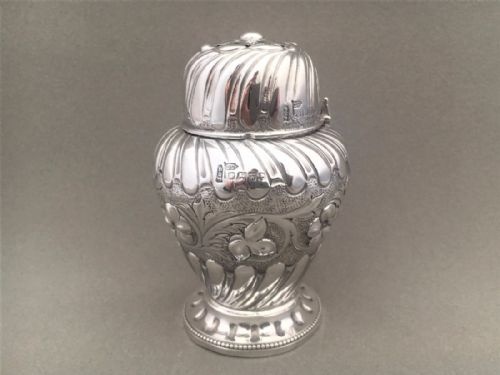 A Fabulous Victorian Repoussé Silver Caster.
