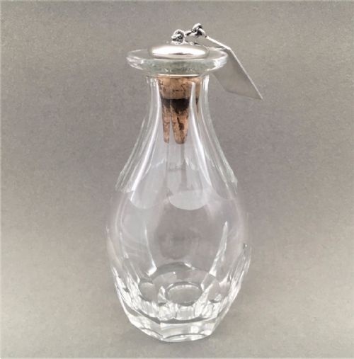 fig 1. An unusual and rare Silver brandy label, stopper and solo glass decanter.
