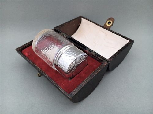 A Charming Edwardian Cased Silver Mounted Salts Bottle.