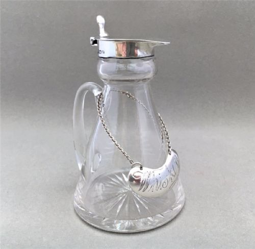 fig 1. A Silver mounted 'Whiskey' tot with silver label.