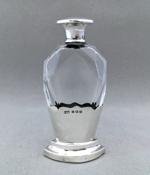 A Charming Silver Mounted Cut Glass Scent Bottle.