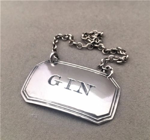 A Georgian Silver Gin Label.