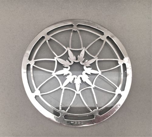 fig 1. An attractive silver teapot stand or coaster.