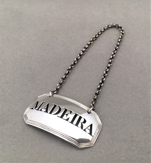 fig 1. A georgian silver Madeira label and spirit decanter.