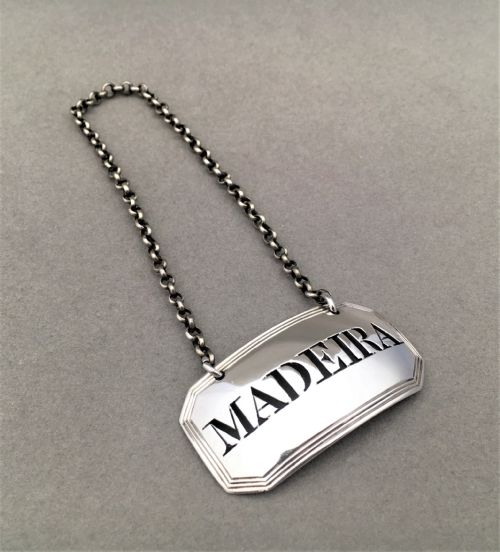 fig 2. A georgian silver Madeira label and spirit decanter.