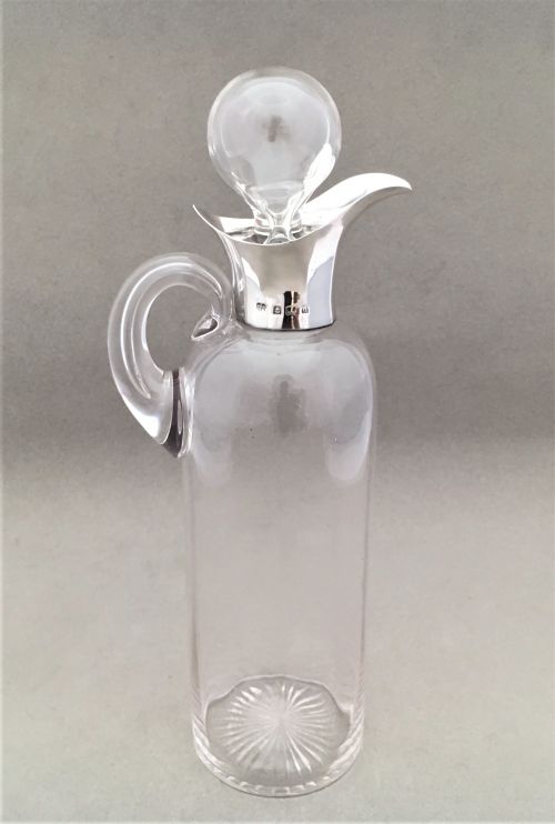 A Charming Edwardian Silver Mounted Oil or Vinegar Bottle.