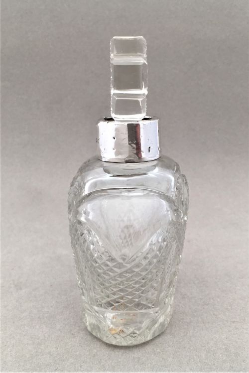 fig 1. A coronation silver mounted cologne bottle.