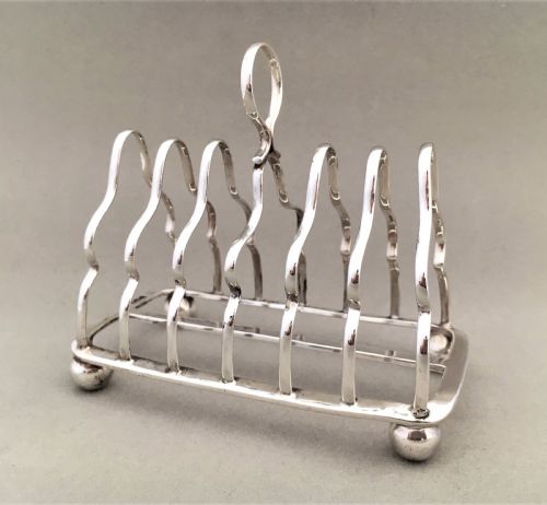 fig 1. An early George V six slice silver toast rack