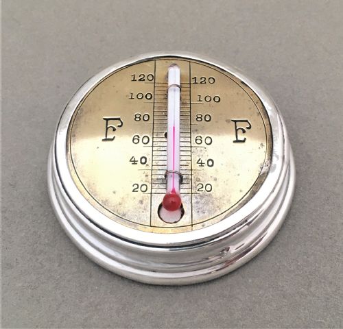A Rare and Unusual Silver Desk Thermometer and Paperweight