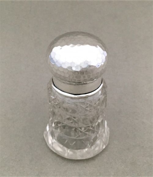 fig 1. A silver mounted scent bottle in the arts and crafts style
