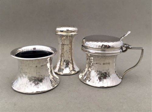 A Silver Arts and Crafts Three Piece Cruet