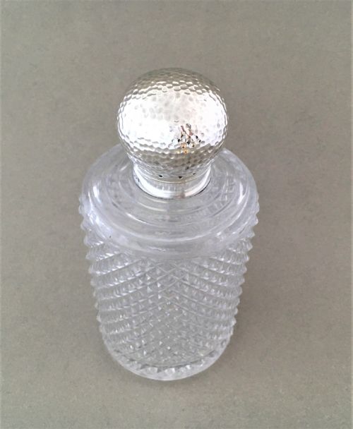 fig 1. An arts & crafts inspired silver mounted cologne bottle