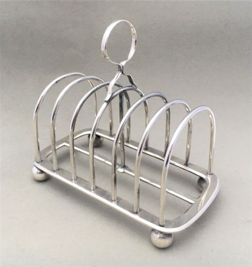 An Edwardian Six Slice Silver Toast Rack