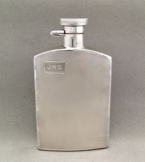 A Silver Hip Flask with Engine Turned Panels