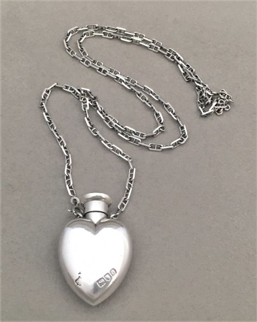 A Gorgeous Silver Heart Shaped Scent Bottle with Silver Chain by Goldsmiths and Silversmiths