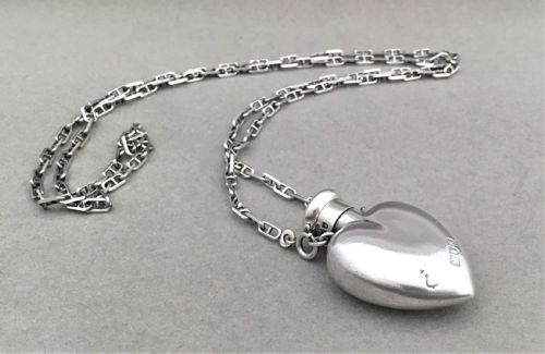 fig 1. A gorgeous silver heart shaped scent bottle with silver chain by Goldsmiths and Silversmiths