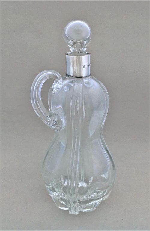 A Charming Silver Mounted Olive Oil or Vinegar Bottle