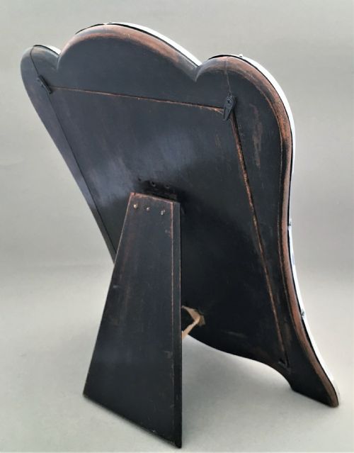 fig 1. A decorative shaped silver photo frame