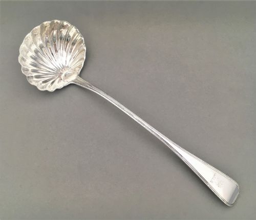 fig 1. A superb George III silver shell bowl soup ladle