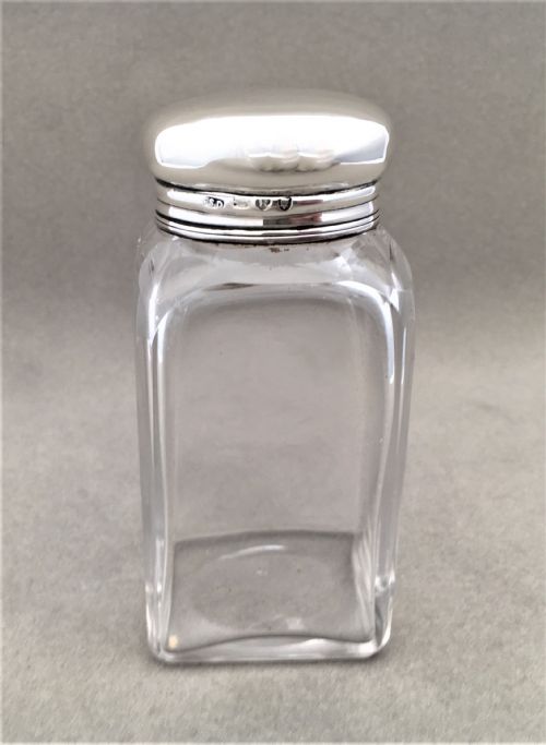 A Stylish Victorian Silver Mounted Cologne Bottle