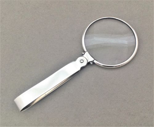 fig 1. An unusual silver folding magnifying glass