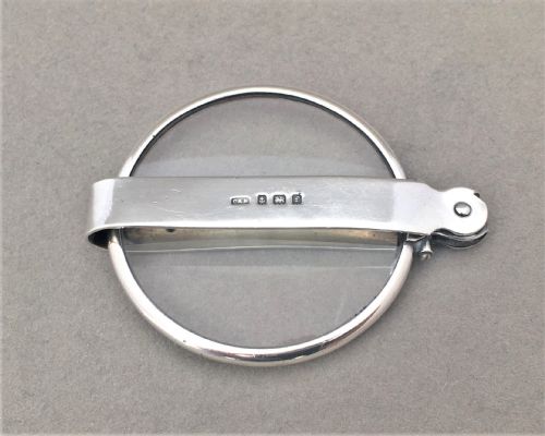fig 2. An unusual silver folding magnifying glass