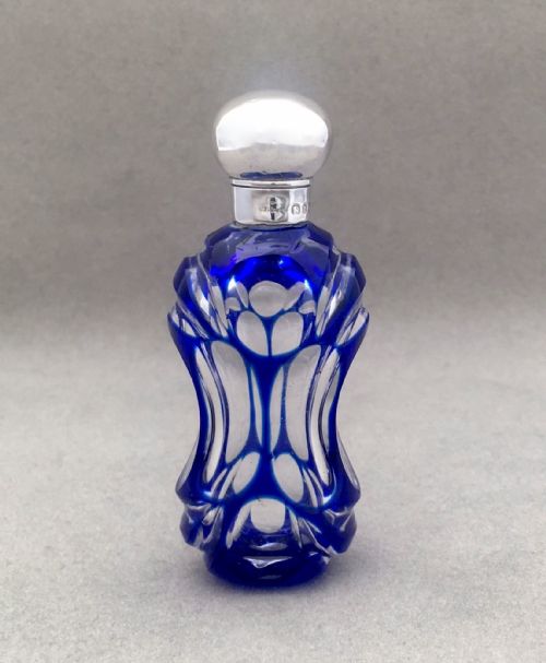 A Victorian Silver Mounted Cut Through Scent Bottle