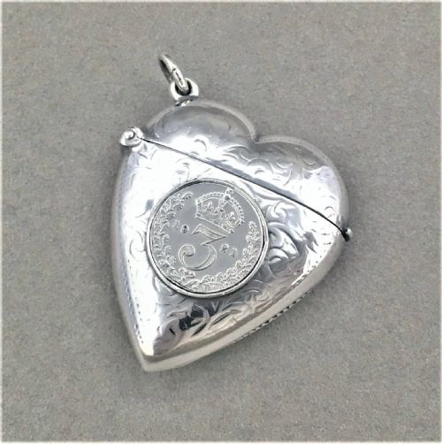 A Sterling Silver Heart Shaped Vesta with Threepenny Bit