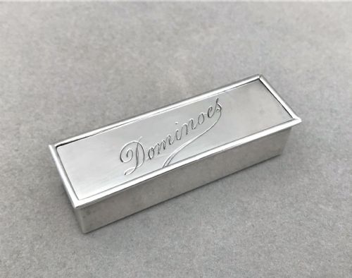 fig 1. An extremely rare silver cased set of dominoes