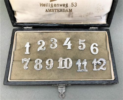 fig 1. An unusual boxed set of silver party numbers