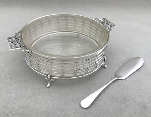 fig 1. An attractive pierced silver butter dish with frosted glass liner