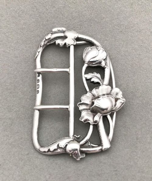 An Exquisite Cast Silver Belt Buckle