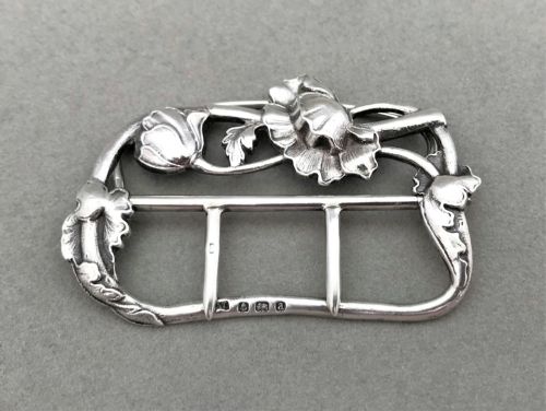 fig 1. An exquisite cast silver belt buckle
