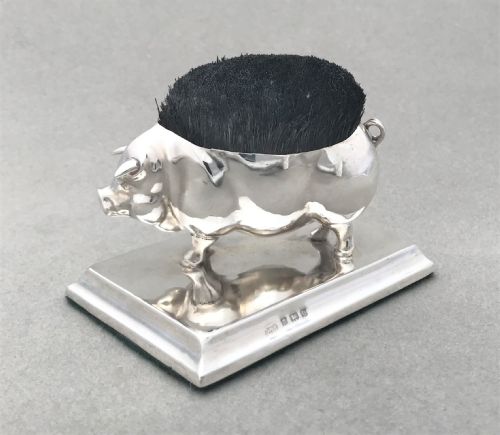A Fantastic Silver Novelty Pig Pen Wipe