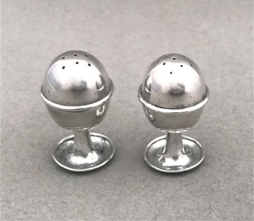 fig 1. A pair of Chester silver miniature egg salt & pepper pots