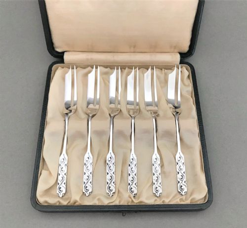 fig 1. A cased set of Liberty & Co silver cake forks