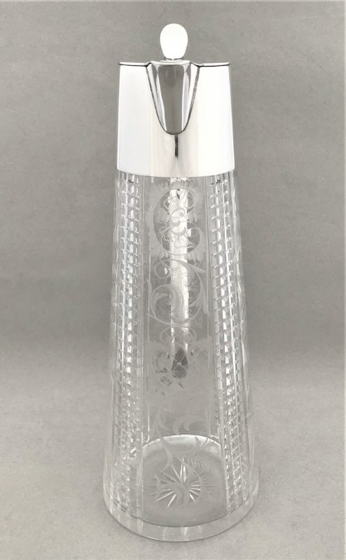 fig 1. A delightful silver plated claret jug