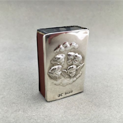 fig 1. A silver Reynolds Angels embossed matchbox case
