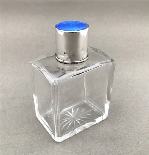 A Silver & Guilloche Enamel Mounted Cologne Bottle