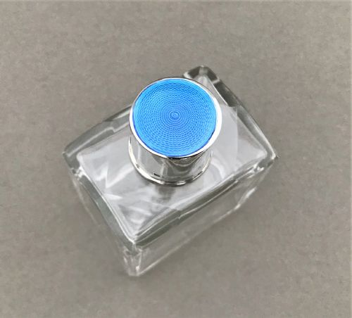 fig 1. A silver & guilloche enamel mounted cologne bottle