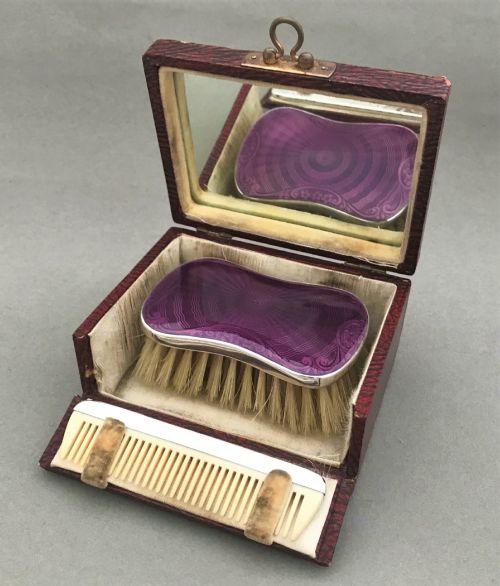 An Exquisite Silver & Guilloche Enamel Cased Brush Set