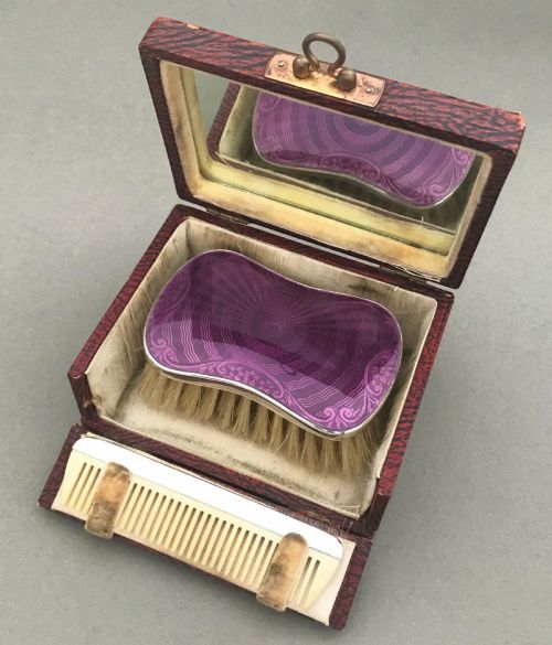fig 1. An exquisite silver & guilloche enamel cased brush set